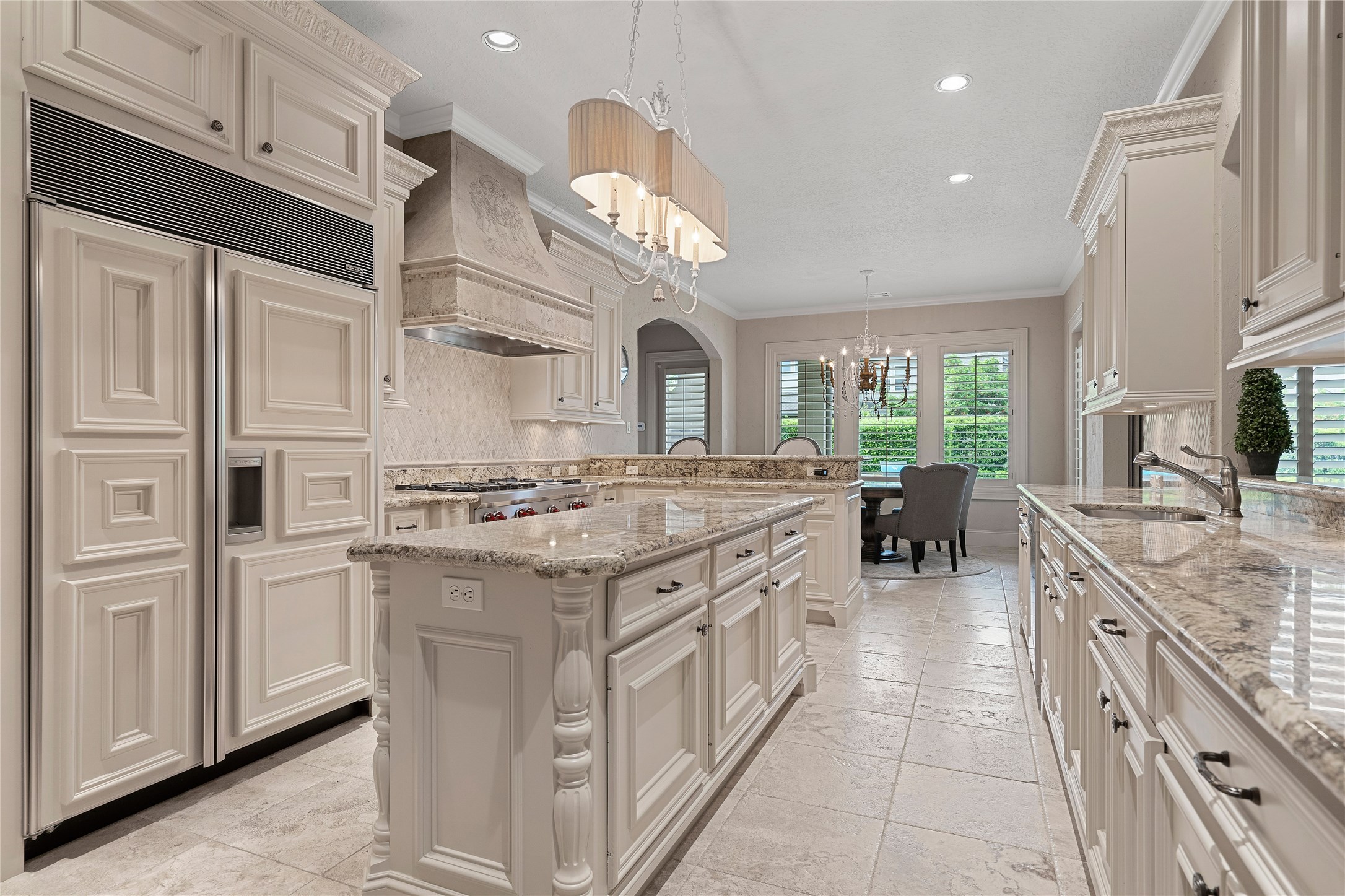 75 South Player Crest Circle Spring, TX 77382 - Photo 15 of 39 a kitchen with a stove top oven sink and cabinets