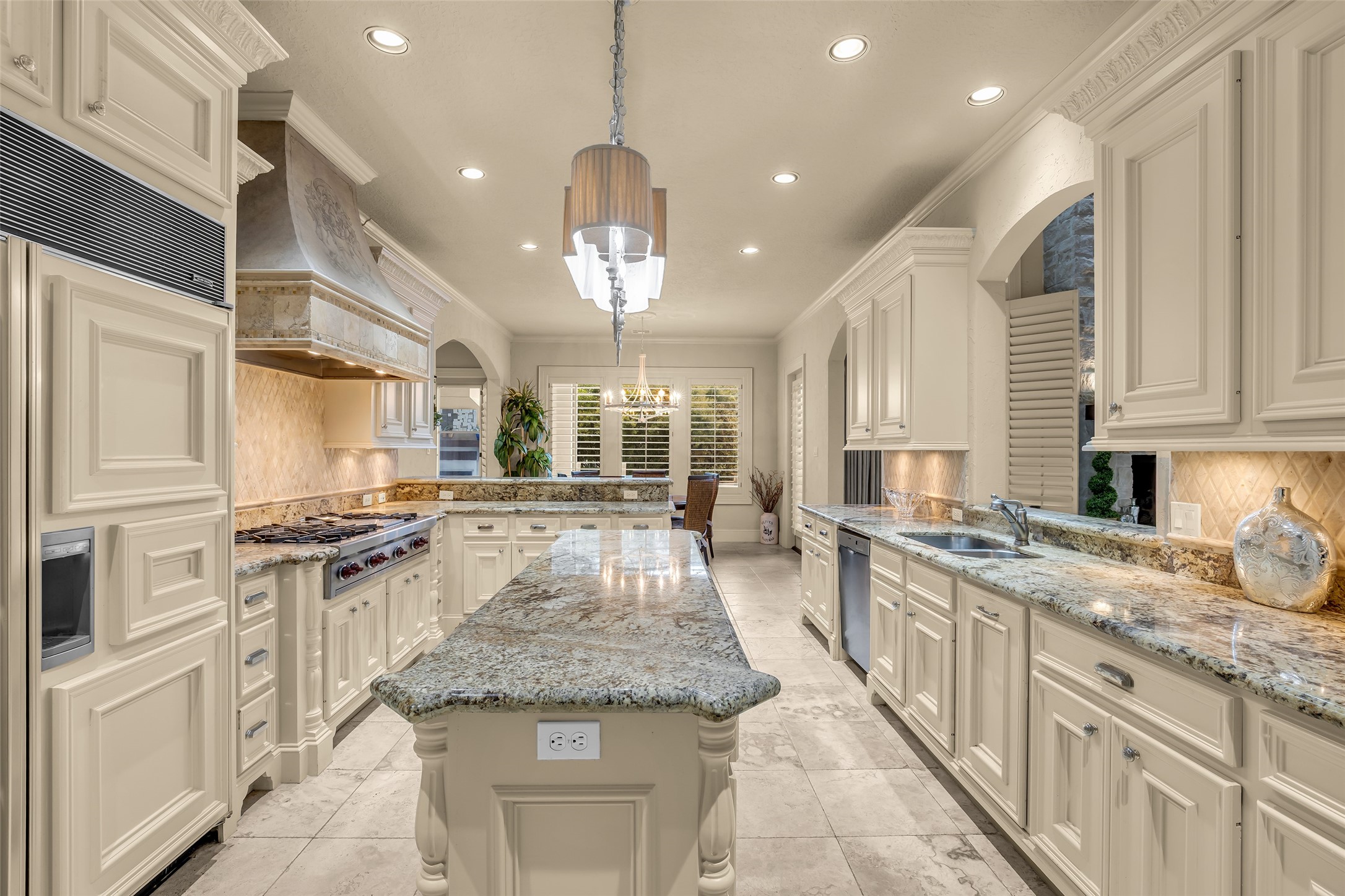 75 South Player Crest Circle Spring, TX 77382 - Photo 17 of 39 a kitchen with stainless steel appliances granite countertop stove top oven and cabinets
