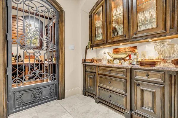 a kitchen with stainless steel appliances granite countertop cabinets and a window