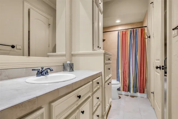 a bathroom with a sink double vanity and a mirror