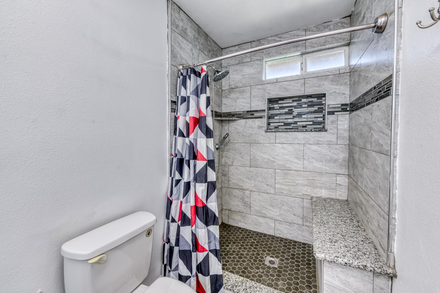 19650 Oakhill Road Madera, CA 93638 - Photo 25 of 49 a bathroom with a shower and a toilet