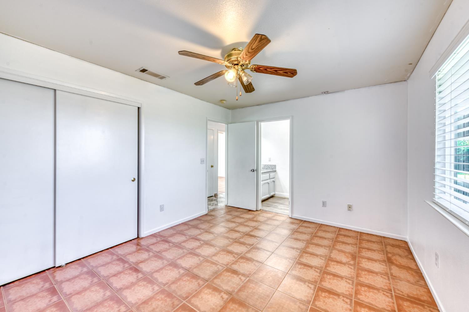 19650 Oakhill Road Madera, CA 93638 - Photo 27 of 49 a view of an empty room with a window