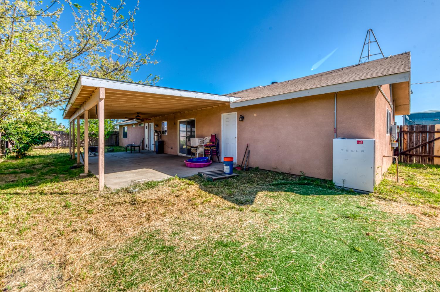 19650 Oakhill Road Madera, CA 93638 - Photo 33 of 49 a view of a backyard with a small cabin and a chair