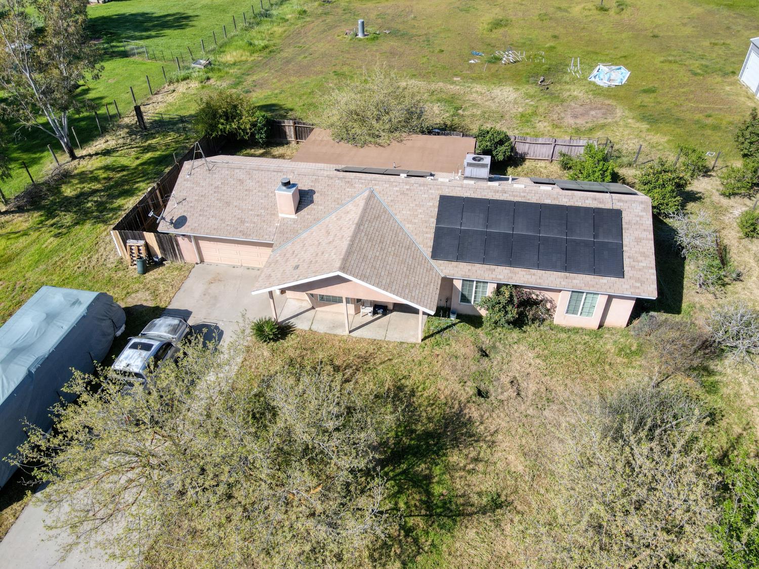 19650 Oakhill Road Madera, CA 93638 - Photo 4 of 49 an aerial view of a house with a yard and lake view