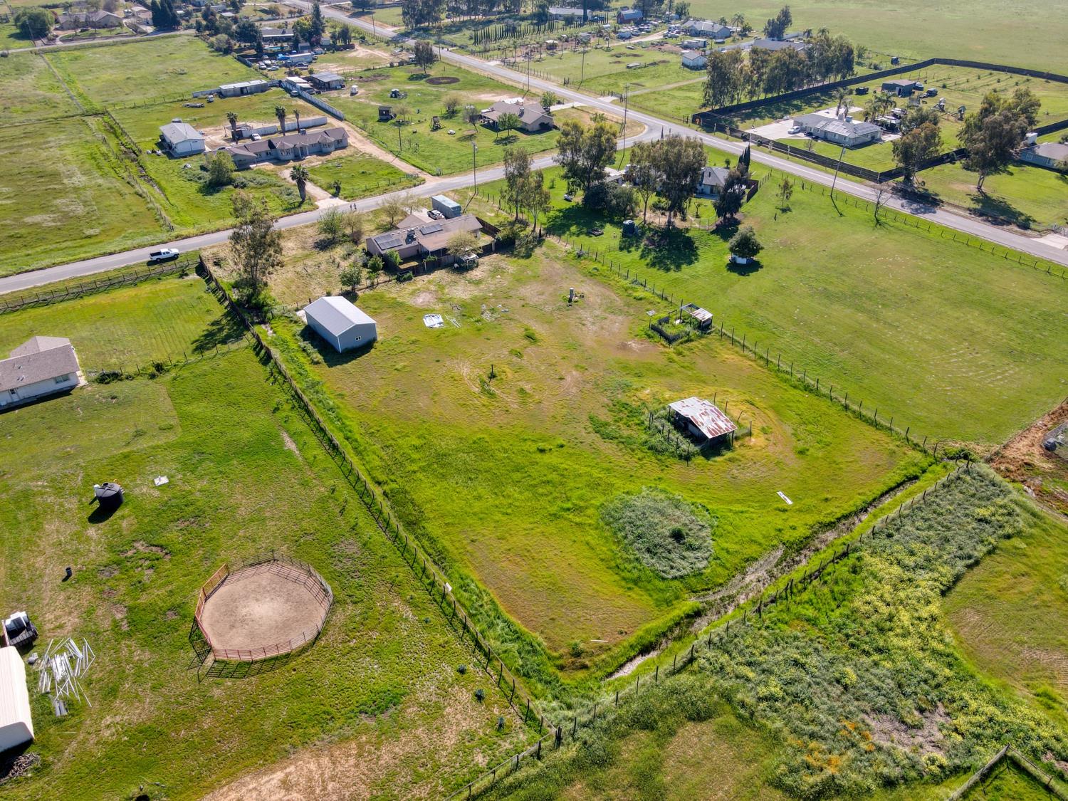 19650 Oakhill Road Madera, CA 93638 - Photo 41 of 49 a view of a swimming pool a yard and mountain view in the background
