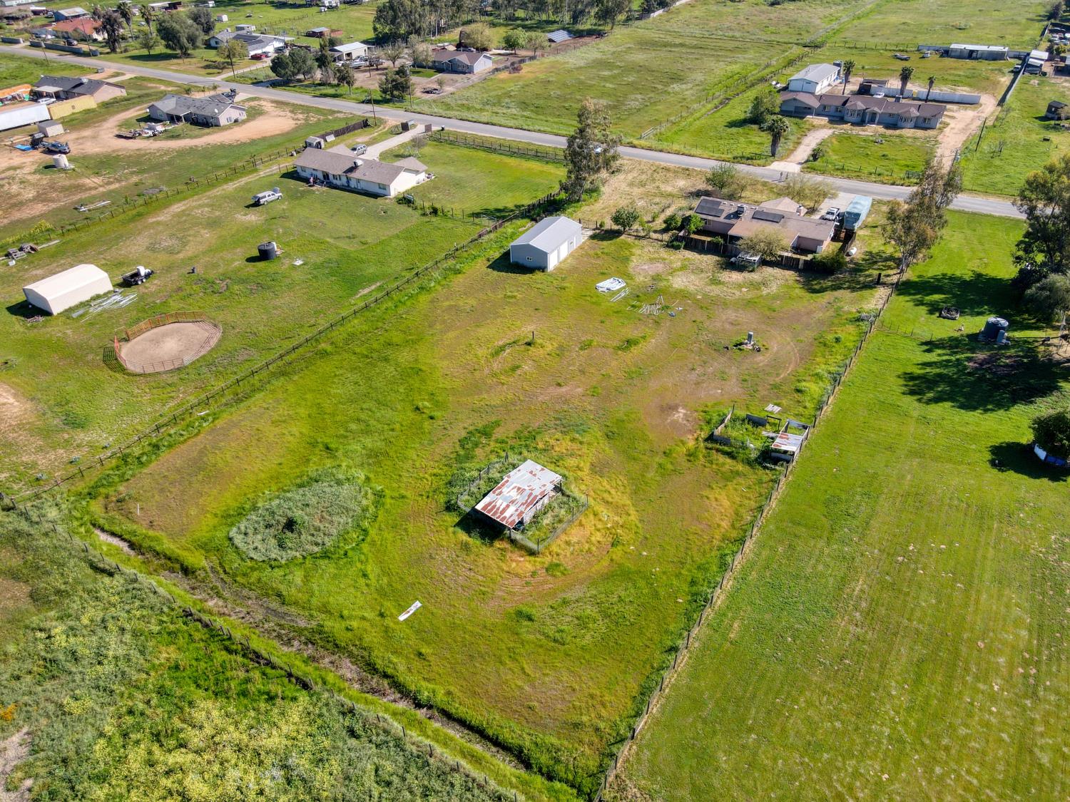 19650 Oakhill Road Madera, CA 93638 - Photo 5 of 49 an aerial view of residential houses with outdoor space