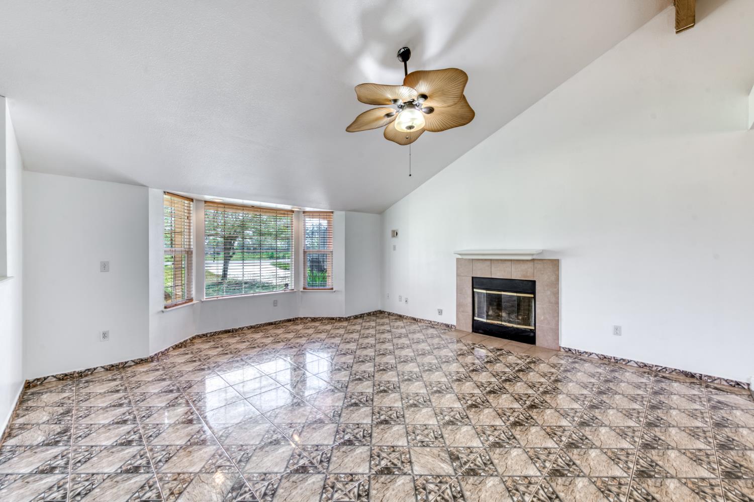 19650 Oakhill Road Madera, CA 93638 - Photo 7 of 49 a view of an empty room with a window and a kitchen