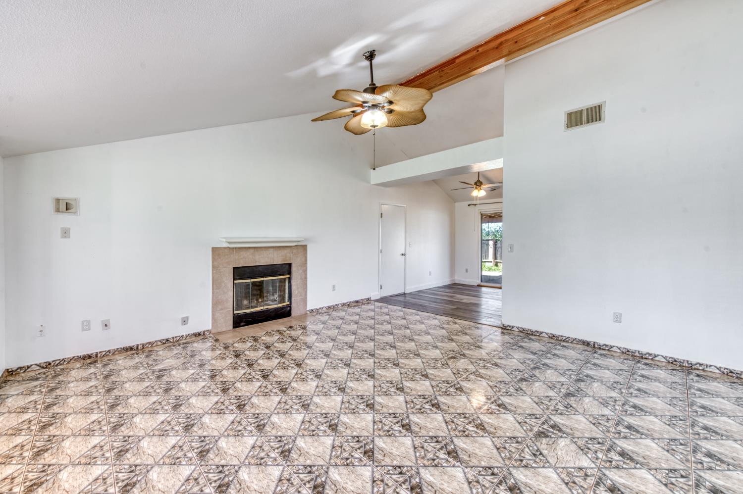 19650 Oakhill Road Madera, CA 93638 - Photo 9 of 49 a view of a livingroom with a chandelier fan and a window