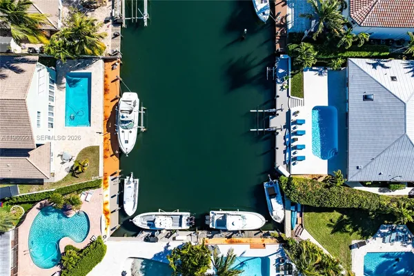 an aerial view of a house with a swimming pool
