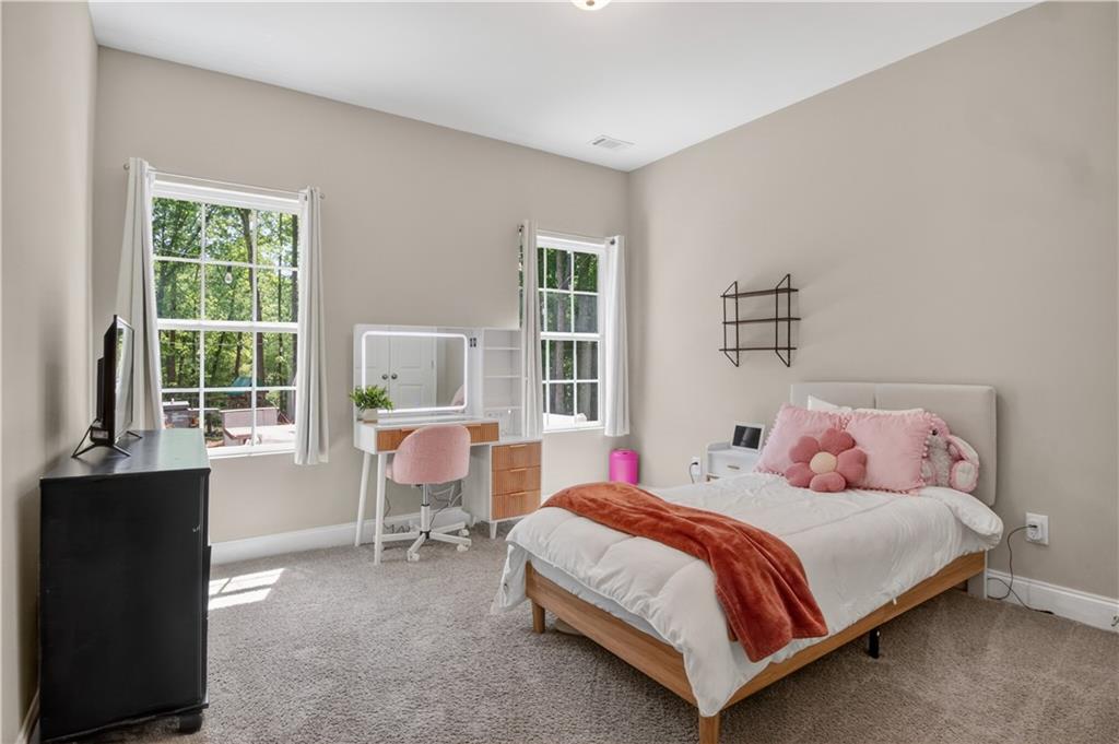584 Tuxedo Drive Commerce, GA 30530 - Photo 17 of 30 a bedroom with a bed and a window