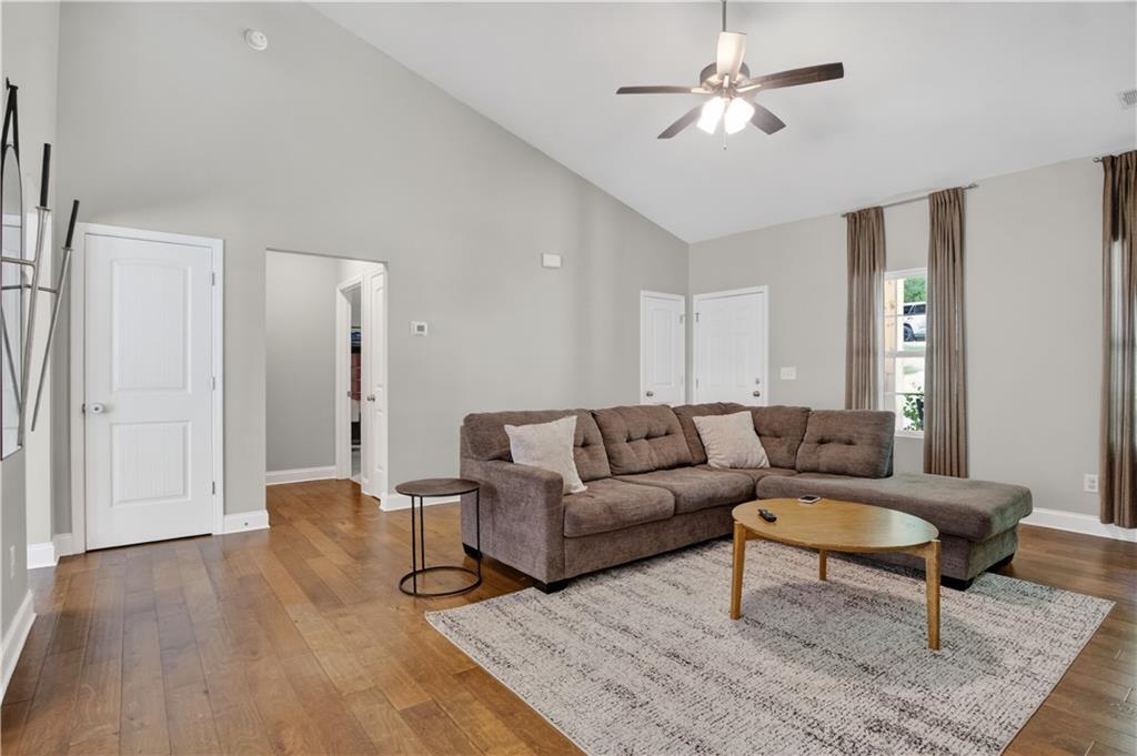584 Tuxedo Drive Commerce, GA 30530 - Photo 5 of 30 a living room with furniture and a rug