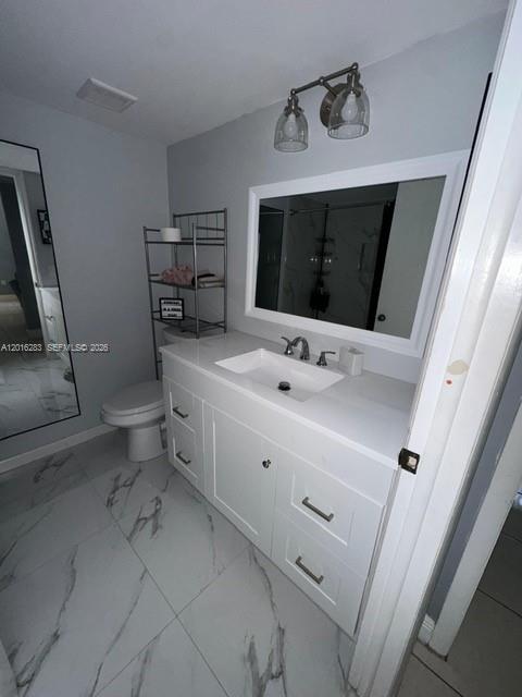 10975 Southwest 107th Street, Unit 110 Miami, FL 33176 - Photo 13 of 26 a bathroom with a sink toilet and mirror