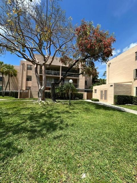 10975 Southwest 107th Street, Unit 110 Miami, FL 33176 - Photo 26 of 26 a view of a house with a yard