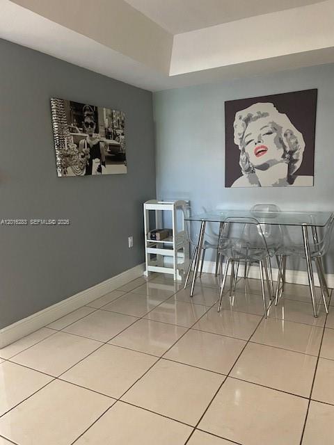 10975 Southwest 107th Street, Unit 110 Miami, FL 33176 - Photo 5 of 26 a view of a livingroom with furniture and a workspace