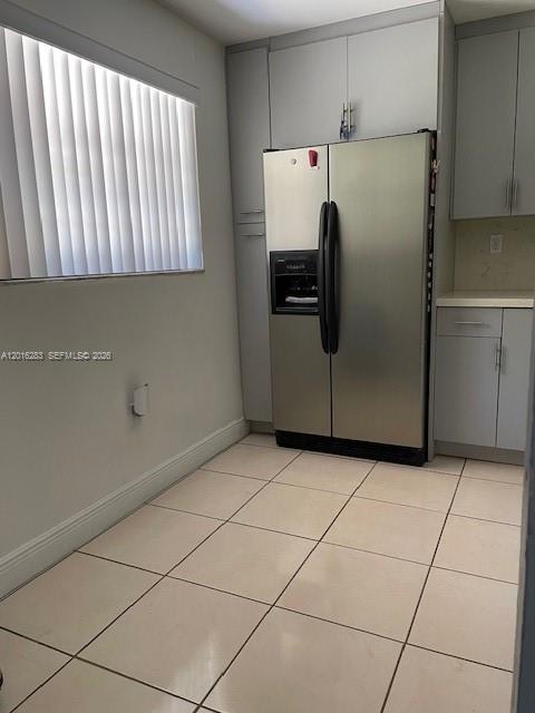 10975 Southwest 107th Street, Unit 110 Miami, FL 33176 - Photo 8 of 26 a kitchen with a refrigerator and a stove top oven