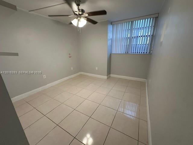 10975 Southwest 107th Street, Unit 110 Miami, FL 33176 - Photo 10 of 26 an empty room with windows