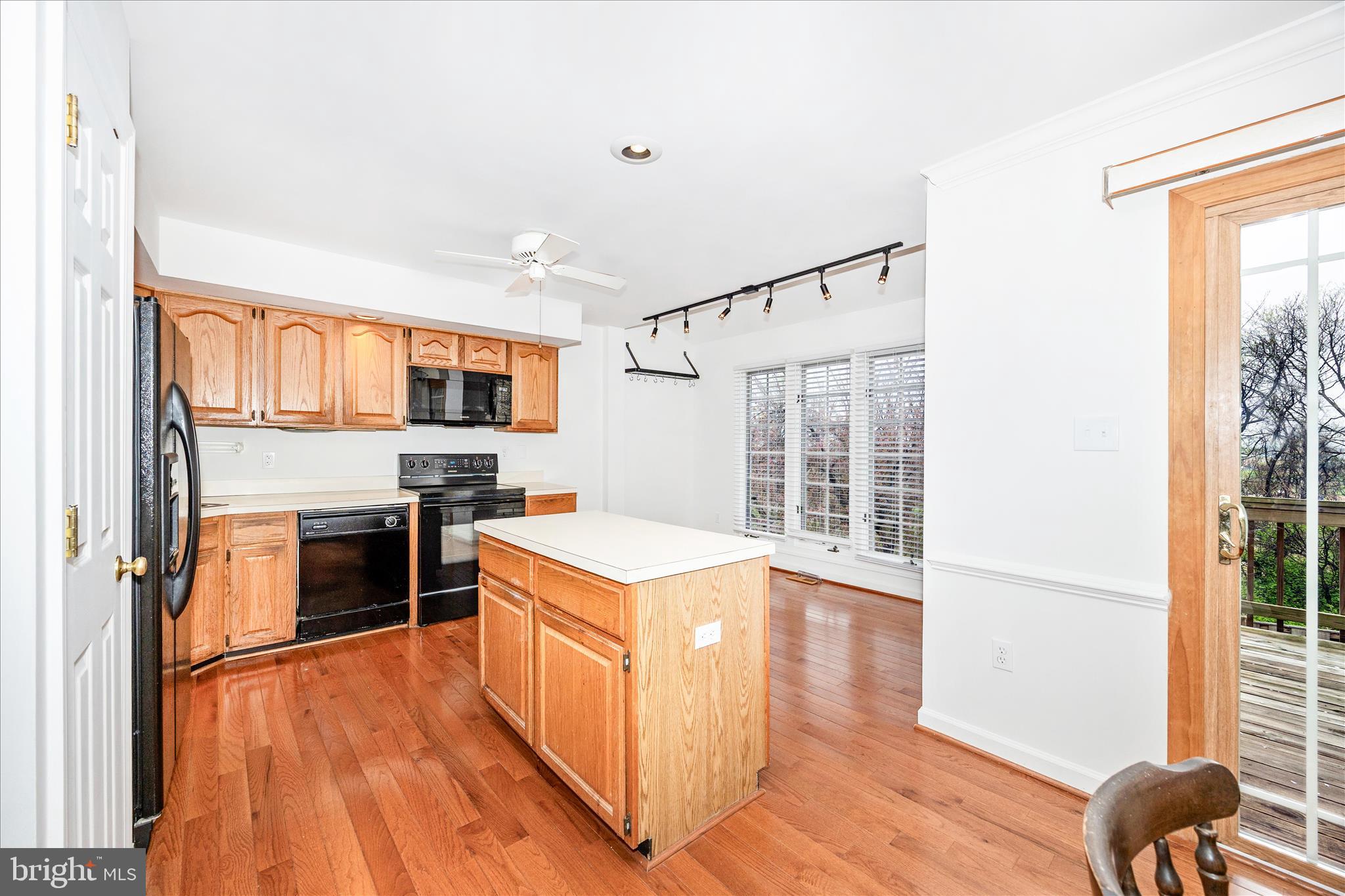 5577 Rivendell Place Frederick, MD 21703 - Photo 11 of 51 a kitchen with a stove top oven and refrigerator