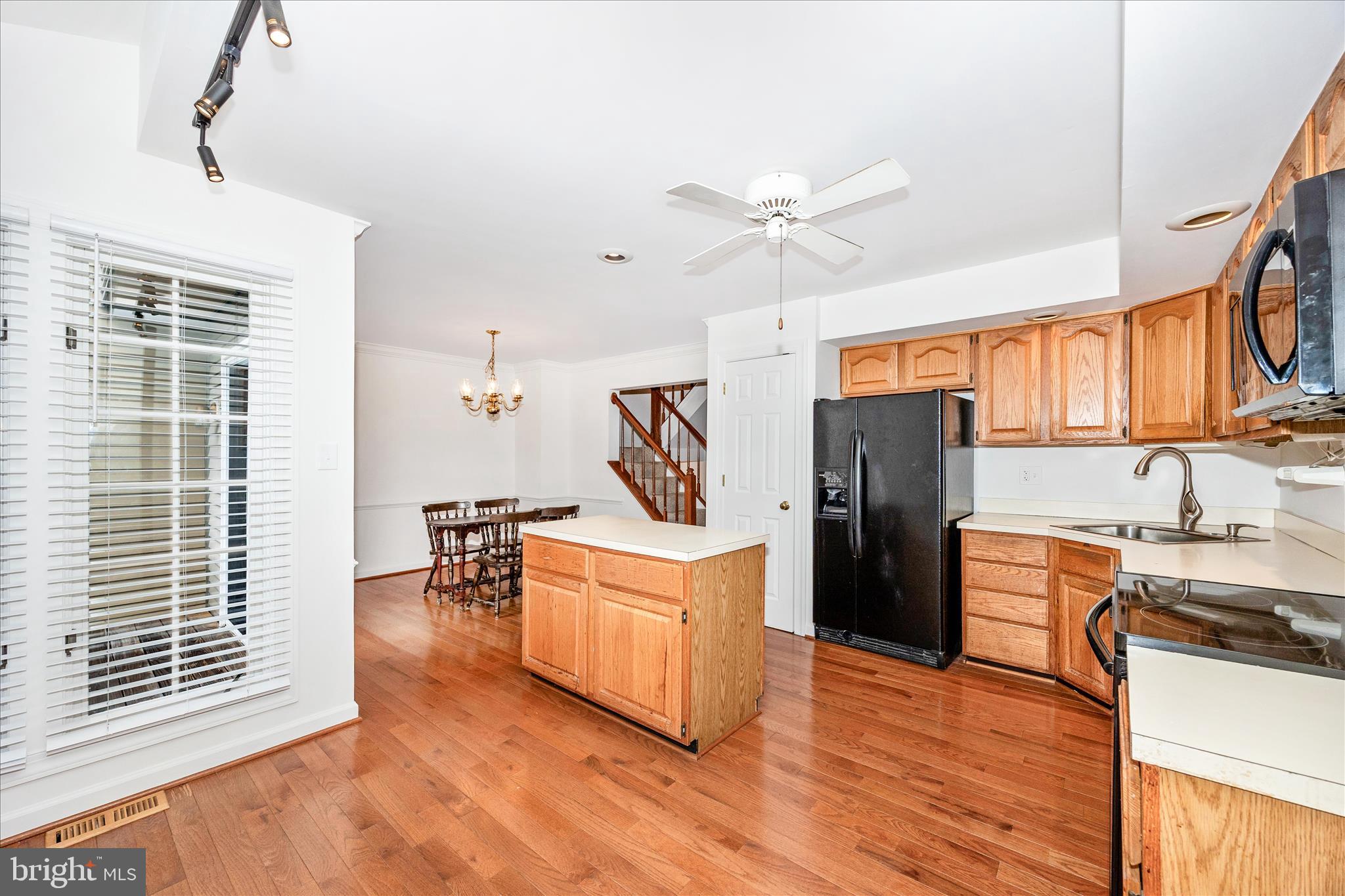 5577 Rivendell Place Frederick, MD 21703 - Photo 13 of 51 a kitchen with stainless steel appliances a stove a refrigerator and a sink