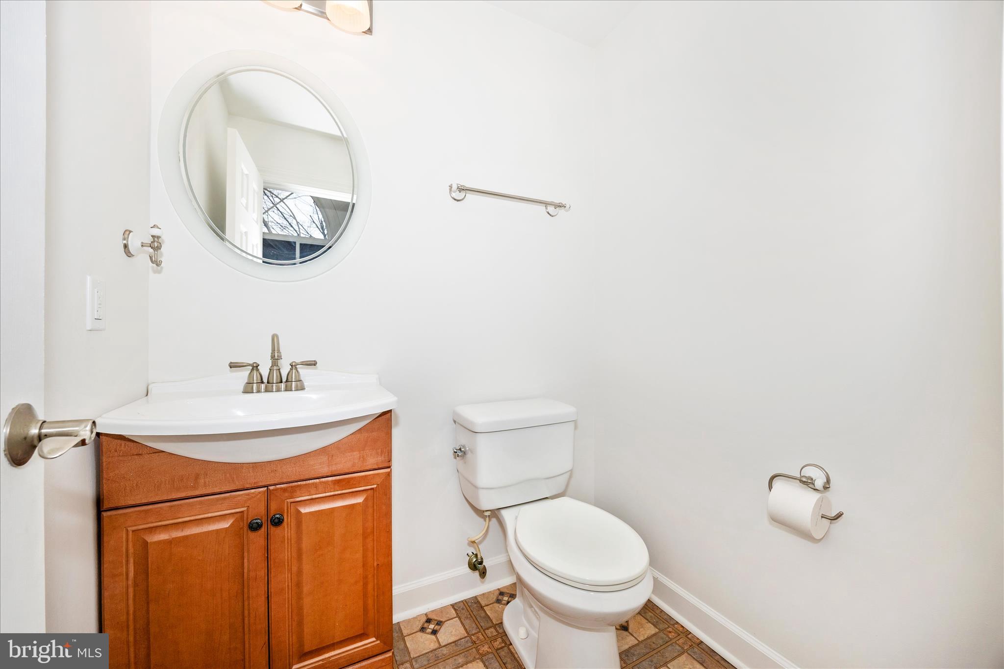 5577 Rivendell Place Frederick, MD 21703 - Photo 17 of 51 a bathroom with a toilet a sink and mirror