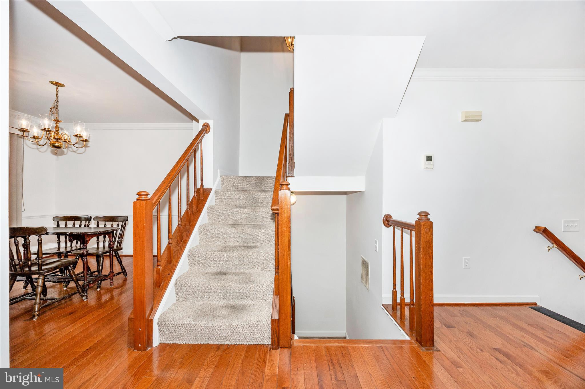 5577 Rivendell Place Frederick, MD 21703 - Photo 18 of 51 a view of entryway and hall with wooden floor