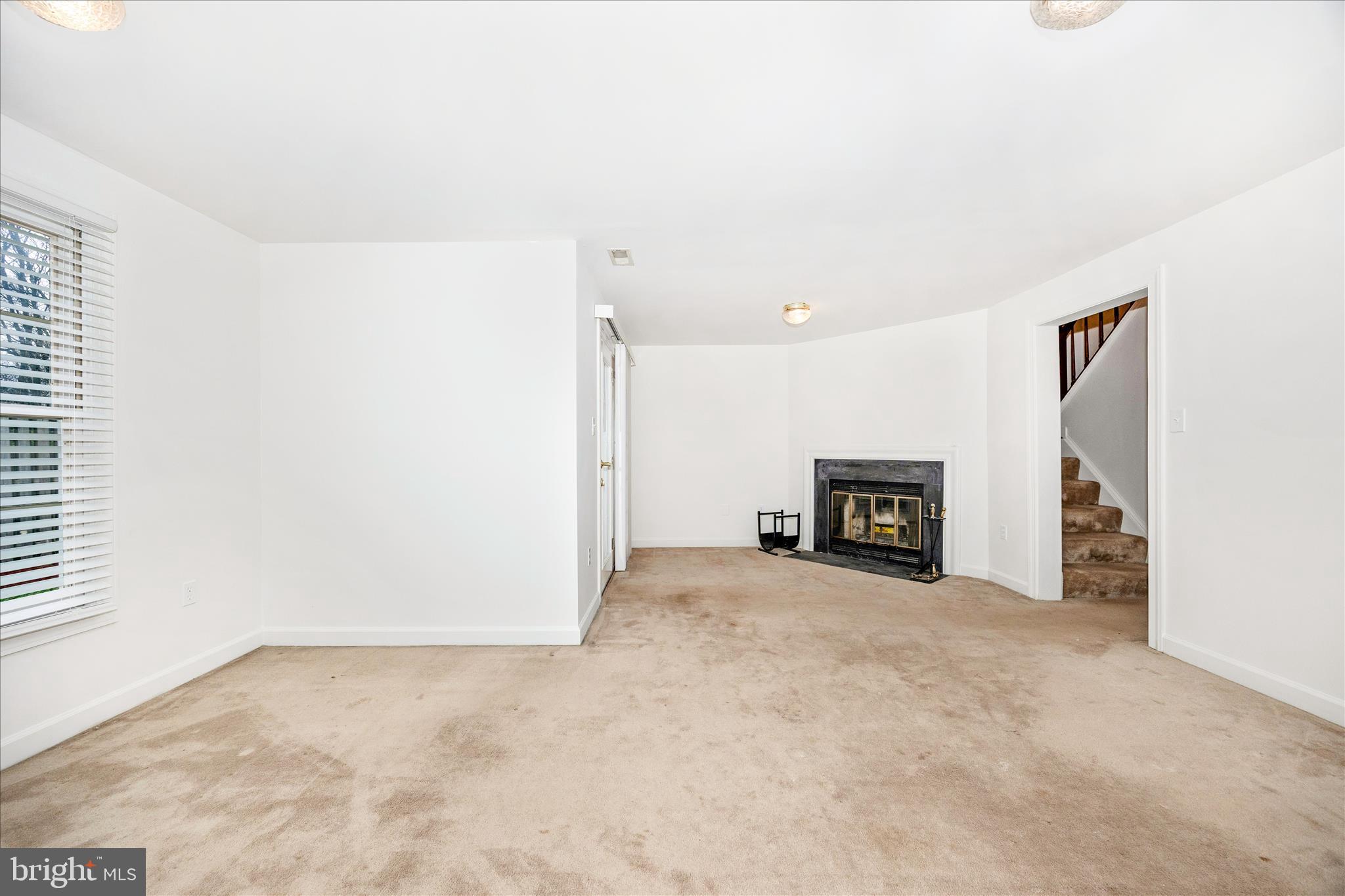 5577 Rivendell Place Frederick, MD 21703 - Photo 33 of 51 an empty room with fireplace