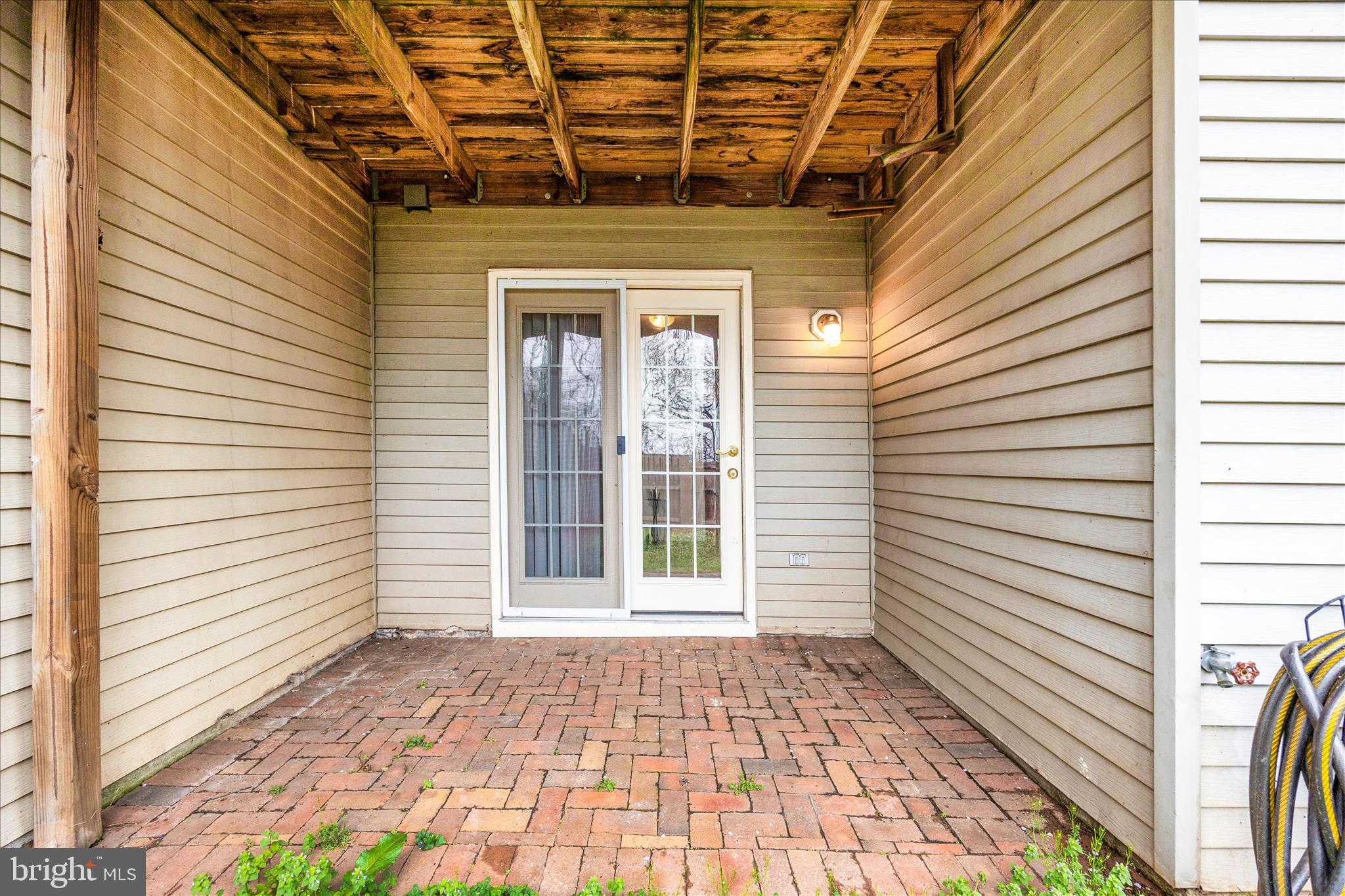 5577 Rivendell Place Frederick, MD 21703 - Photo 40 of 51 a view of a porch with a table and chairs