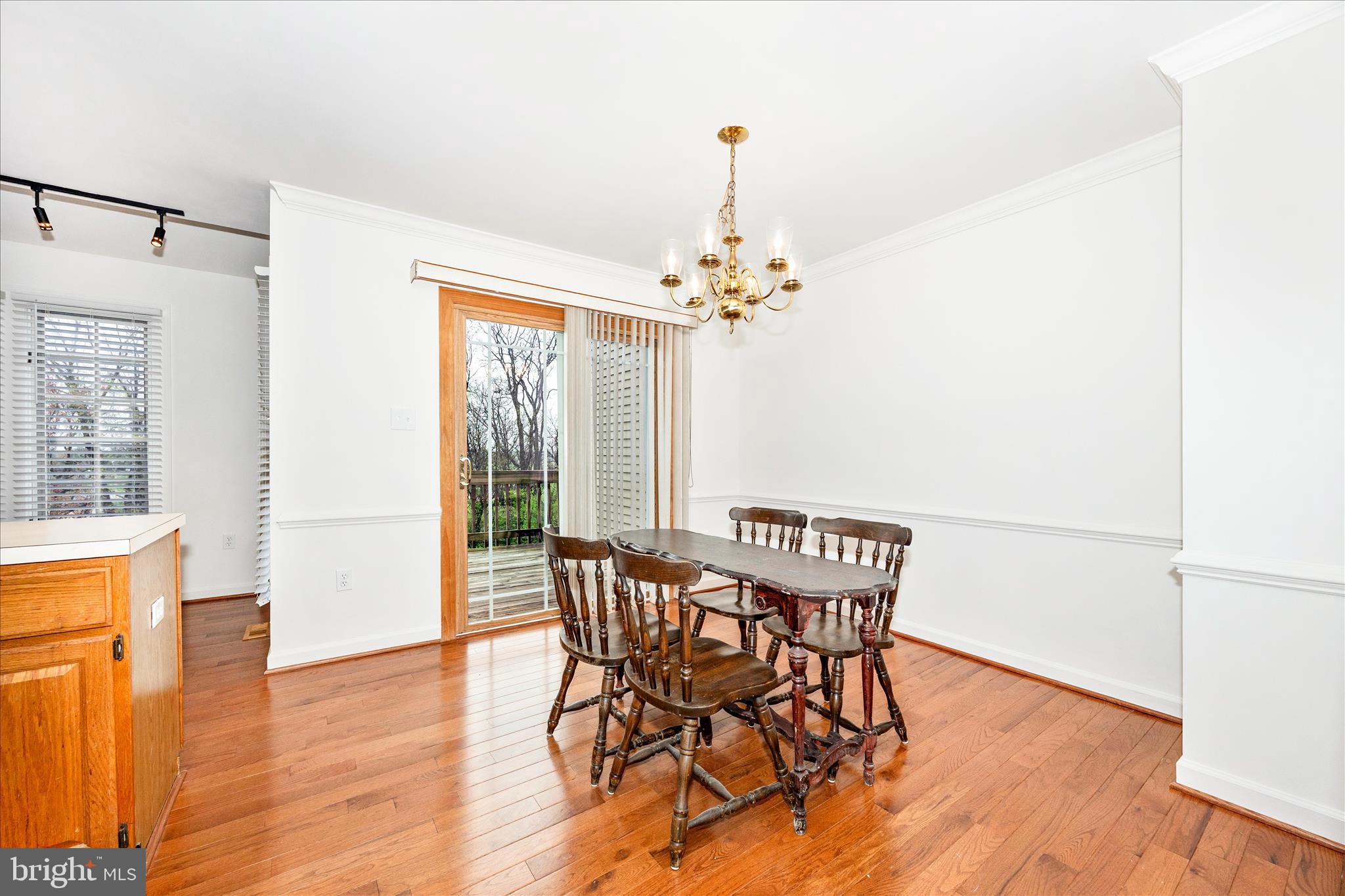5577 Rivendell Place Frederick, MD 21703 - Photo 8 of 51 a view of a dining room with furniture window and wooden floor