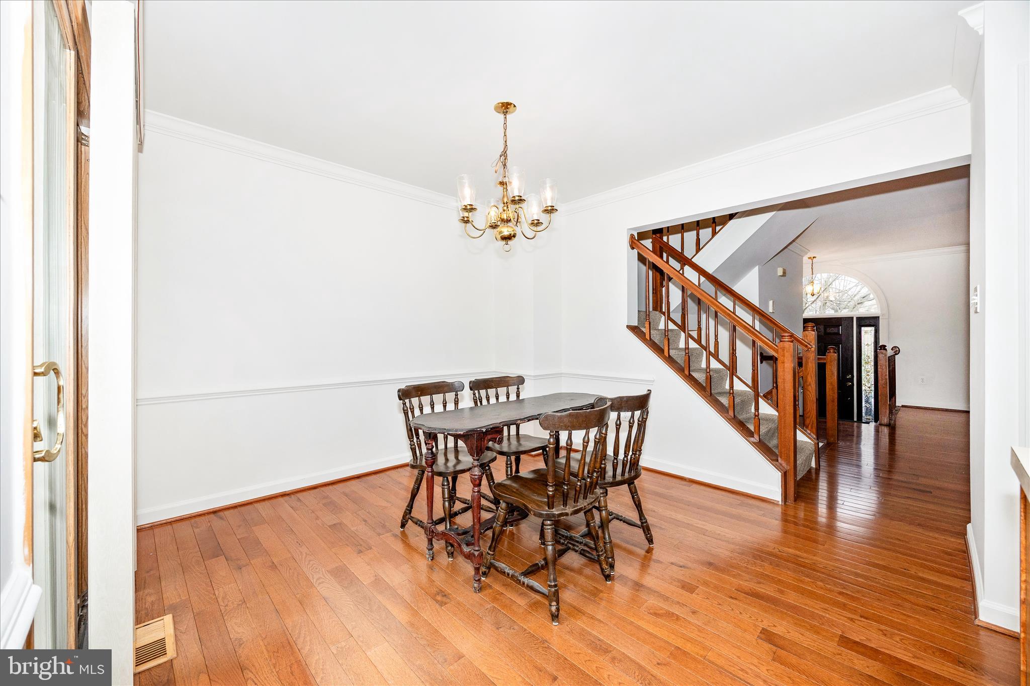 5577 Rivendell Place Frederick, MD 21703 - Photo 9 of 51 a dining room with furniture entryway and wooden floor