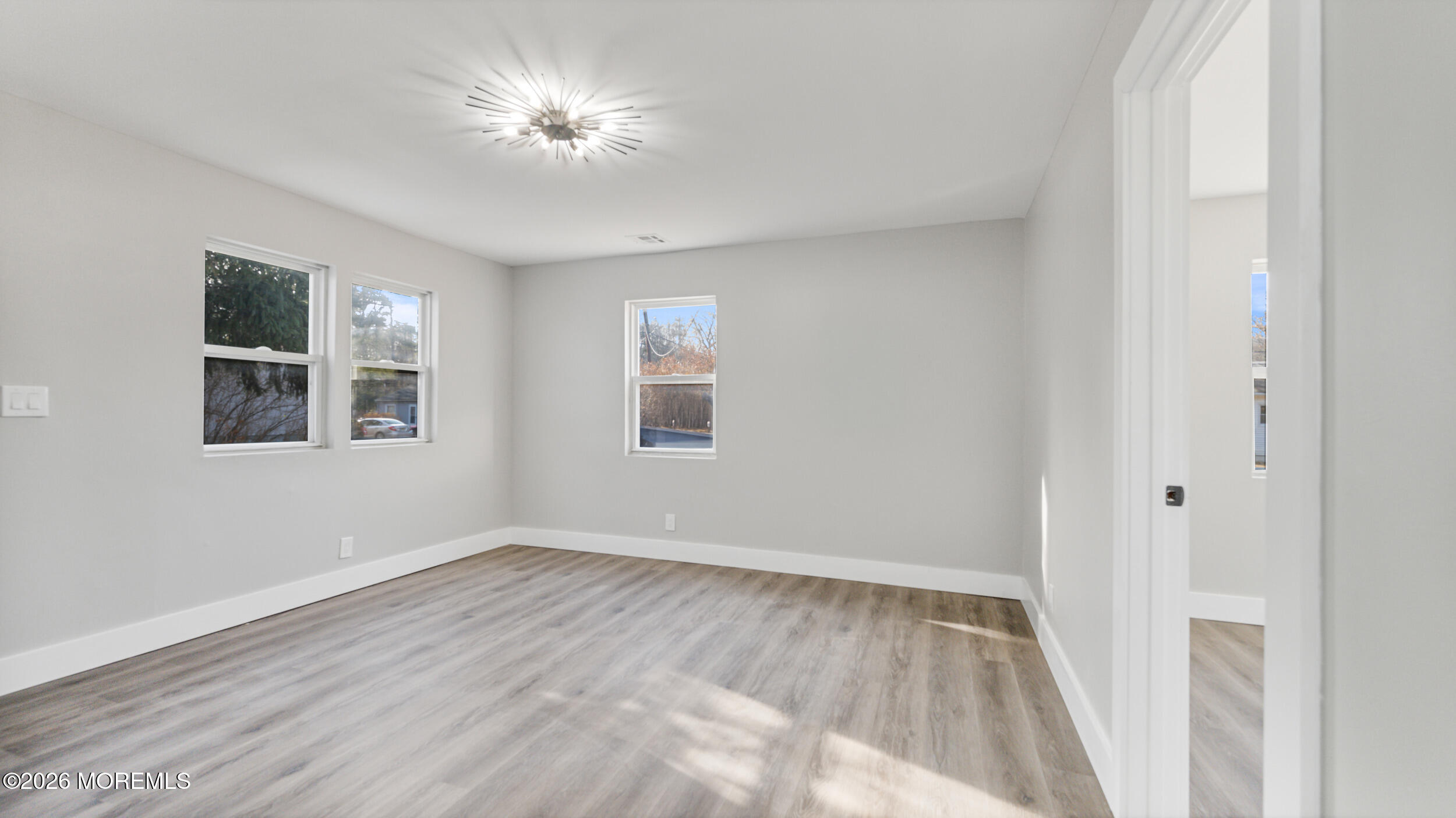 4 Story Street New Egypt, NJ 08533 - Photo 12 of 16 a view of empty room with wooden floor and fan