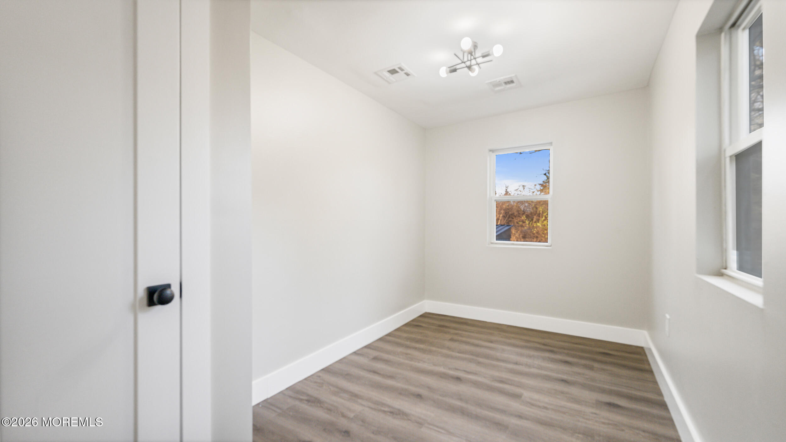 4 Story Street New Egypt, NJ 08533 - Photo 13 of 16 a view of a room with wooden floor and a ceiling fan