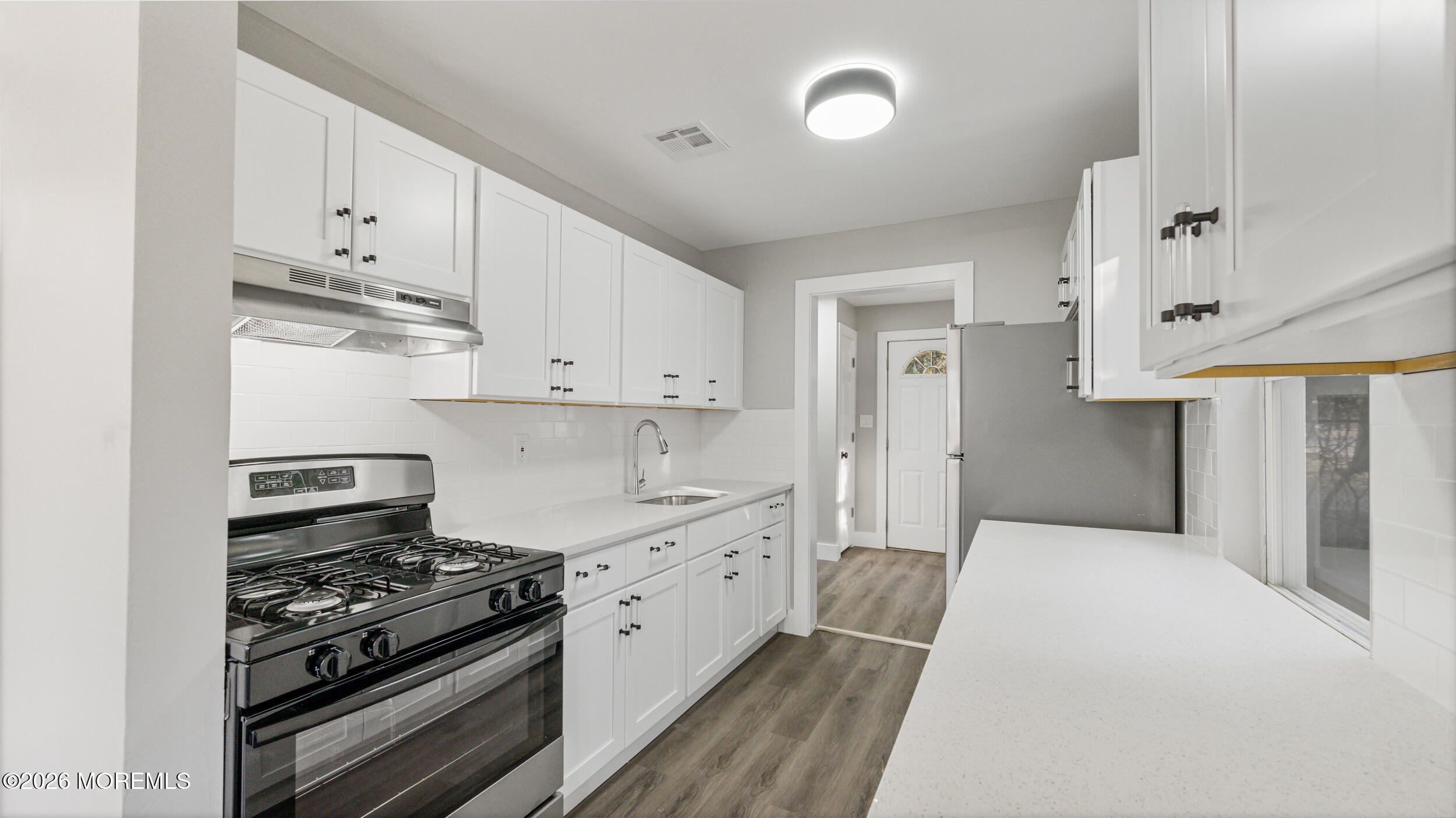4 Story Street New Egypt, NJ 08533 - Photo 5 of 16 a kitchen with stainless steel appliances a stove and white cabinets