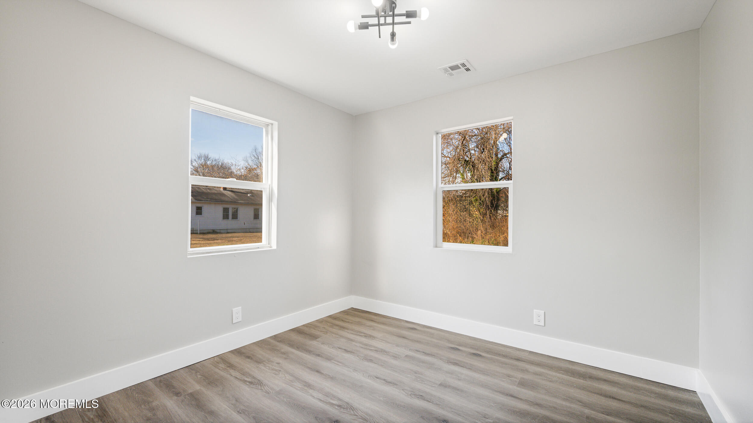 4 Story Street New Egypt, NJ 08533 - Photo 10 of 16 an empty room with wooden floor and windows