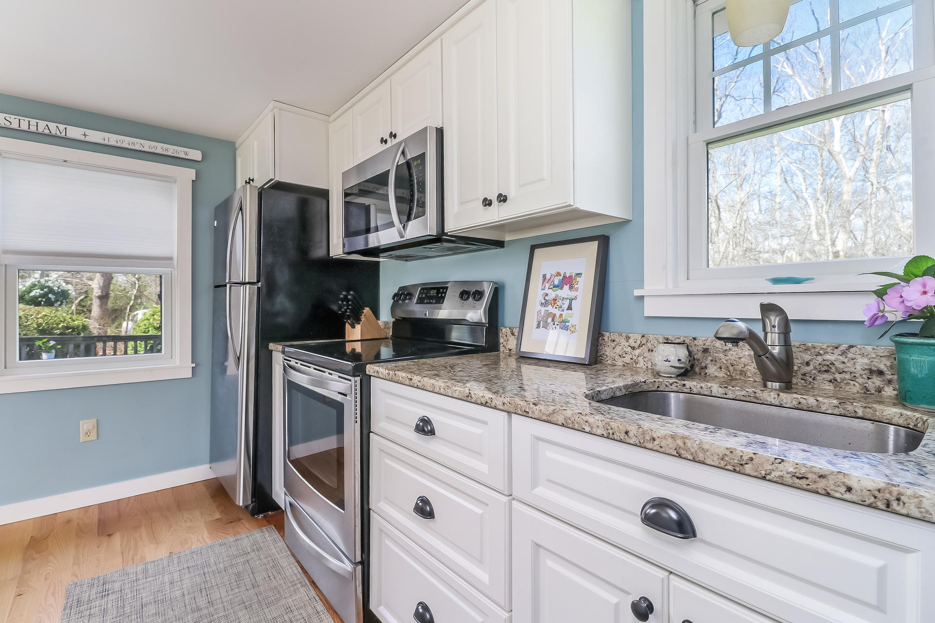 50 Oak Ridge Road Eastham, MA 02642 - Photo 12 of 20 a kitchen with stainless steel appliances granite countertop a sink and a stove next to a window