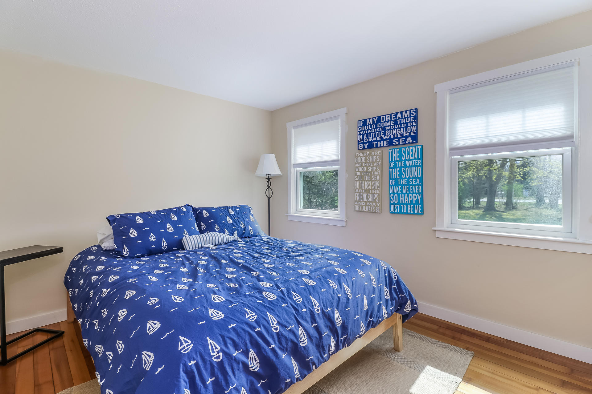50 Oak Ridge Road Eastham, MA 02642 - Photo 13 of 20 a large bed sitting in a bedroom next to a window