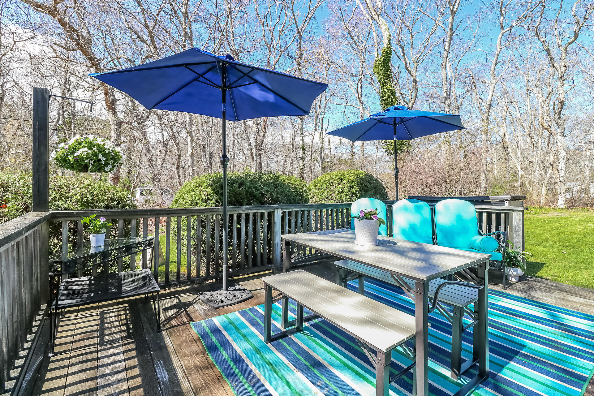 50 Oak Ridge Road Eastham, MA 02642 - Photo 17 of 20 a view of a patio with a table chairs under an umbrella