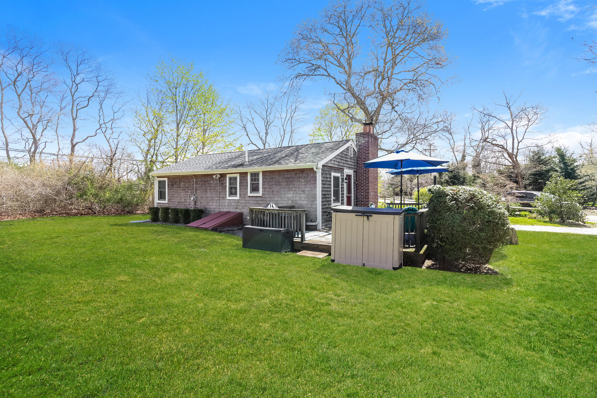 50 Oak Ridge Road Eastham, MA 02642 - Photo 18 of 20 a view of a house with backyard and a tree