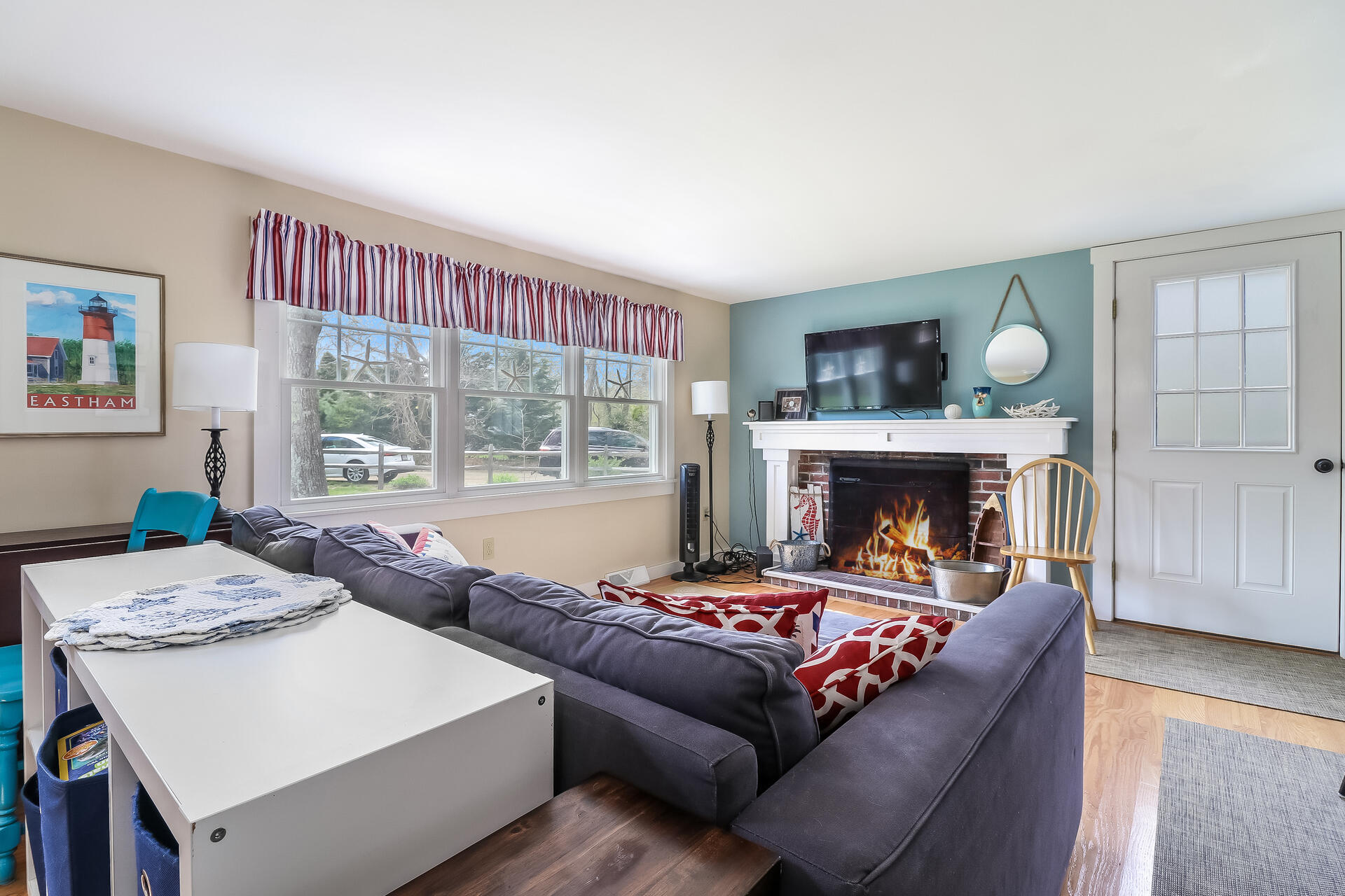 50 Oak Ridge Road Eastham, MA 02642 - Photo 3 of 20 a living room with furniture and a fireplace