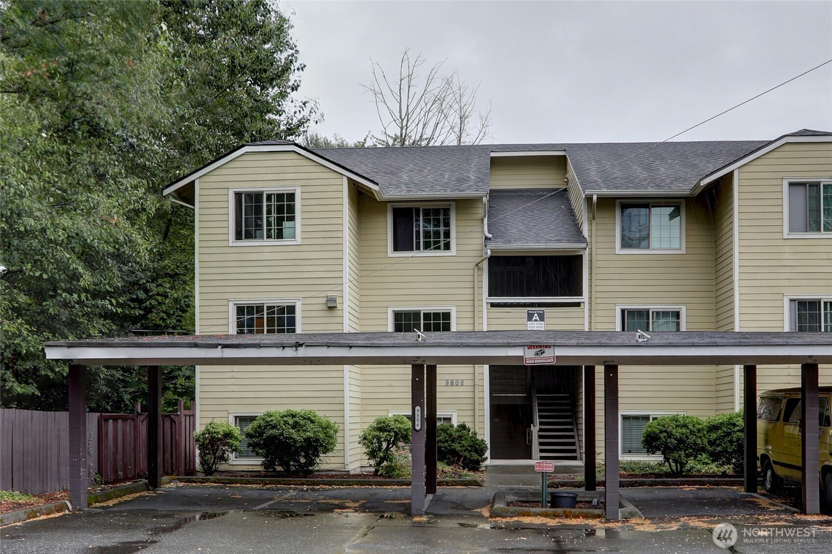 9806 28th Avenue Southwest, Unit A201 Seattle, WA 98126 - Photo 1 of 14 a front view of a house with garage