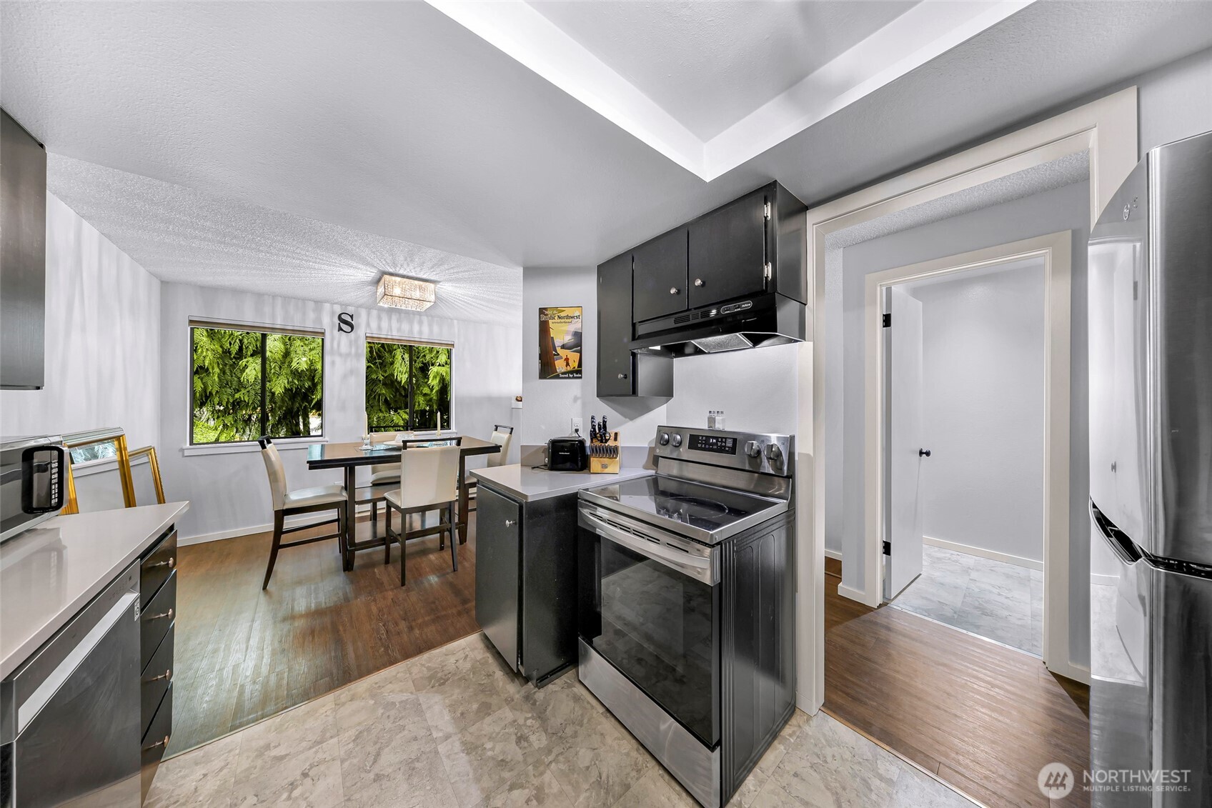 1211 North 8th Street, Unit 2 Mount Vernon, WA 98273 - Photo 15 of 38 a kitchen that has a lot of cabinets a sink and appliances in it