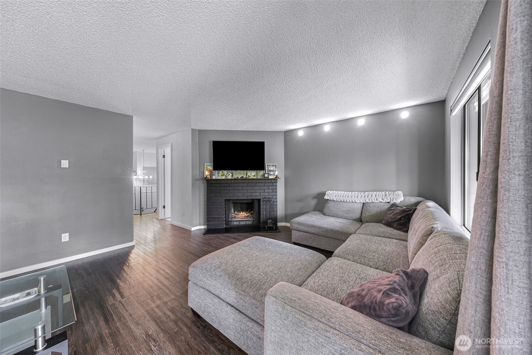 1211 North 8th Street, Unit 2 Mount Vernon, WA 98273 - Photo 21 of 38 a living room with furniture and a fireplace
