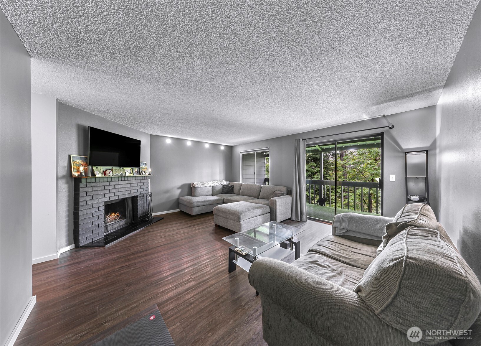 1211 North 8th Street, Unit 2 Mount Vernon, WA 98273 - Photo 22 of 38 a living room with furniture fireplace and a flat screen tv