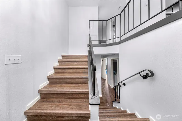 a view of a porch with chairs and backyard