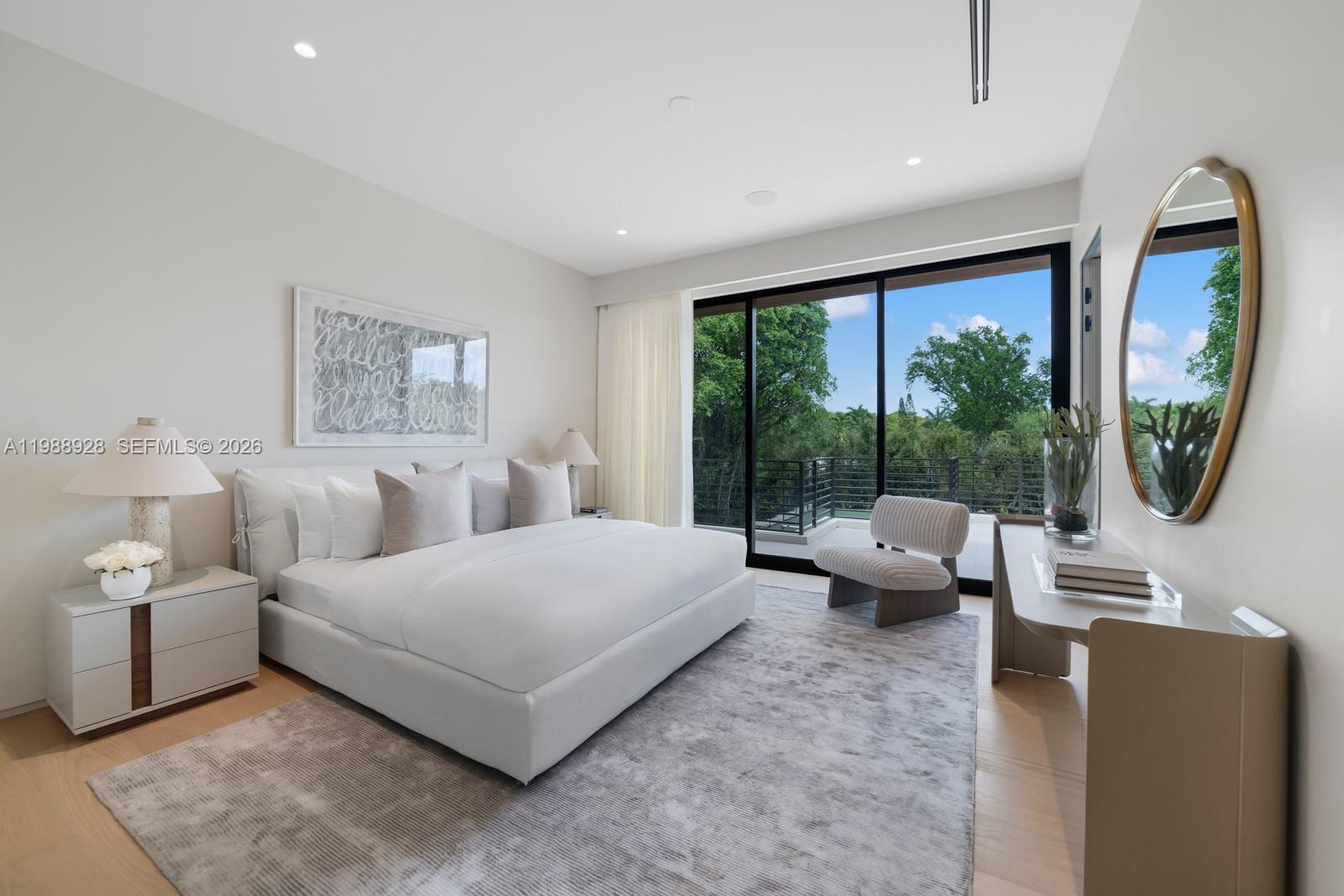 5545 Southwest 81st Terrace Miami, FL 33143 - Photo 29 of 100 a bedroom with a large bed and a large window