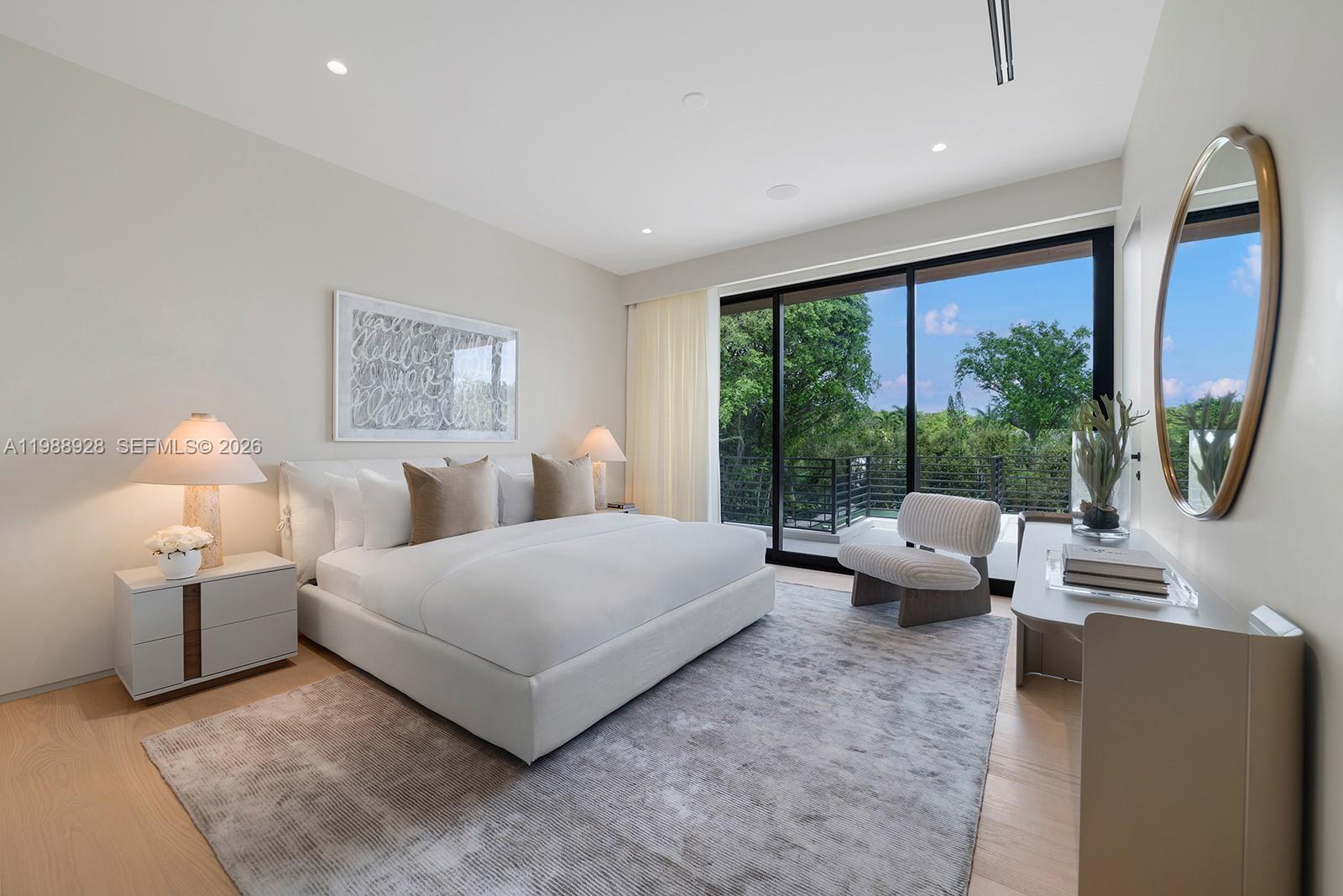 5545 Southwest 81st Terrace Miami, FL 33143 - Photo 30 of 100 a spacious bedroom with a large bed and a large window