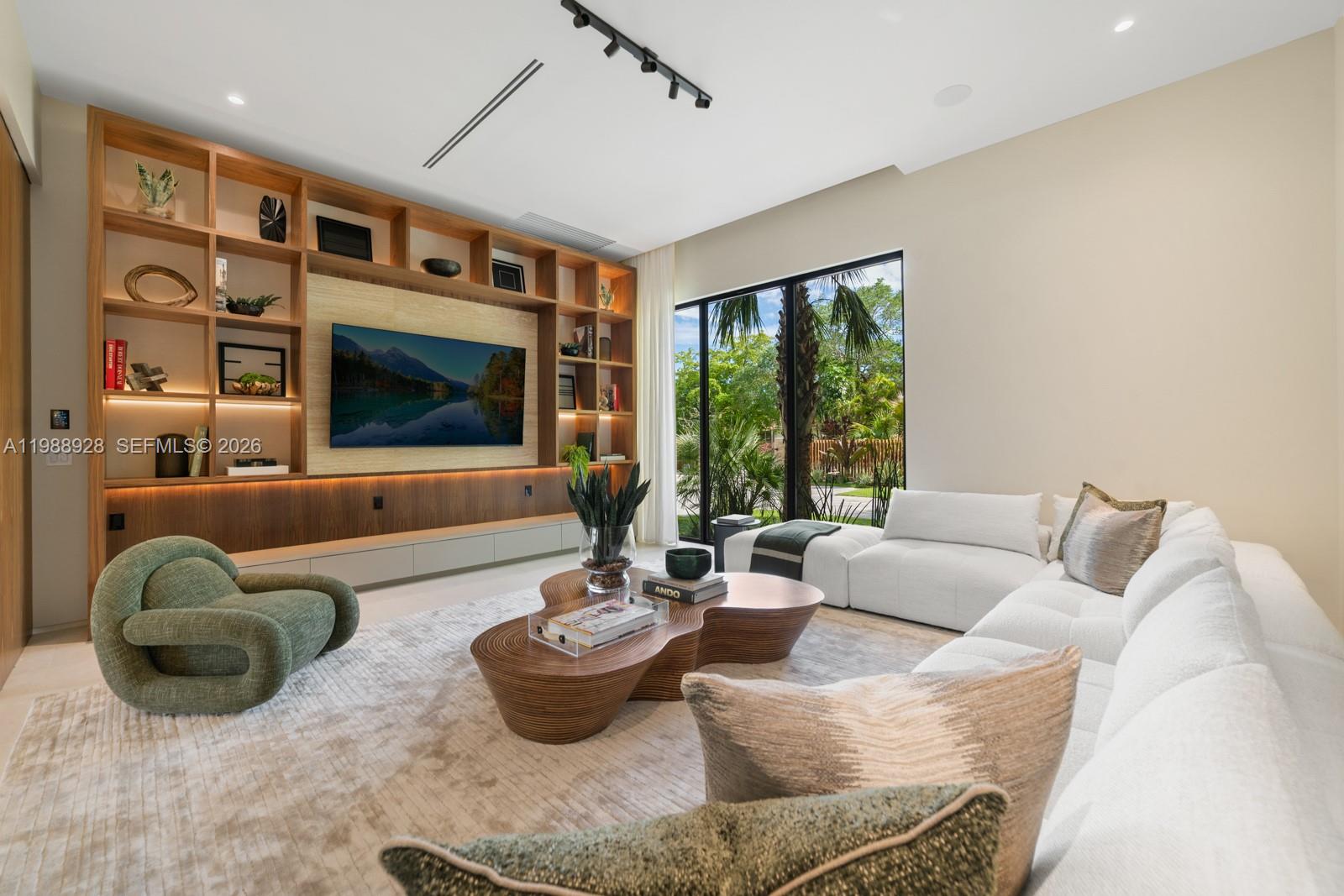 5545 Southwest 81st Terrace Miami, FL 33143 - Photo 3 of 100 a living room with furniture and a flat screen tv