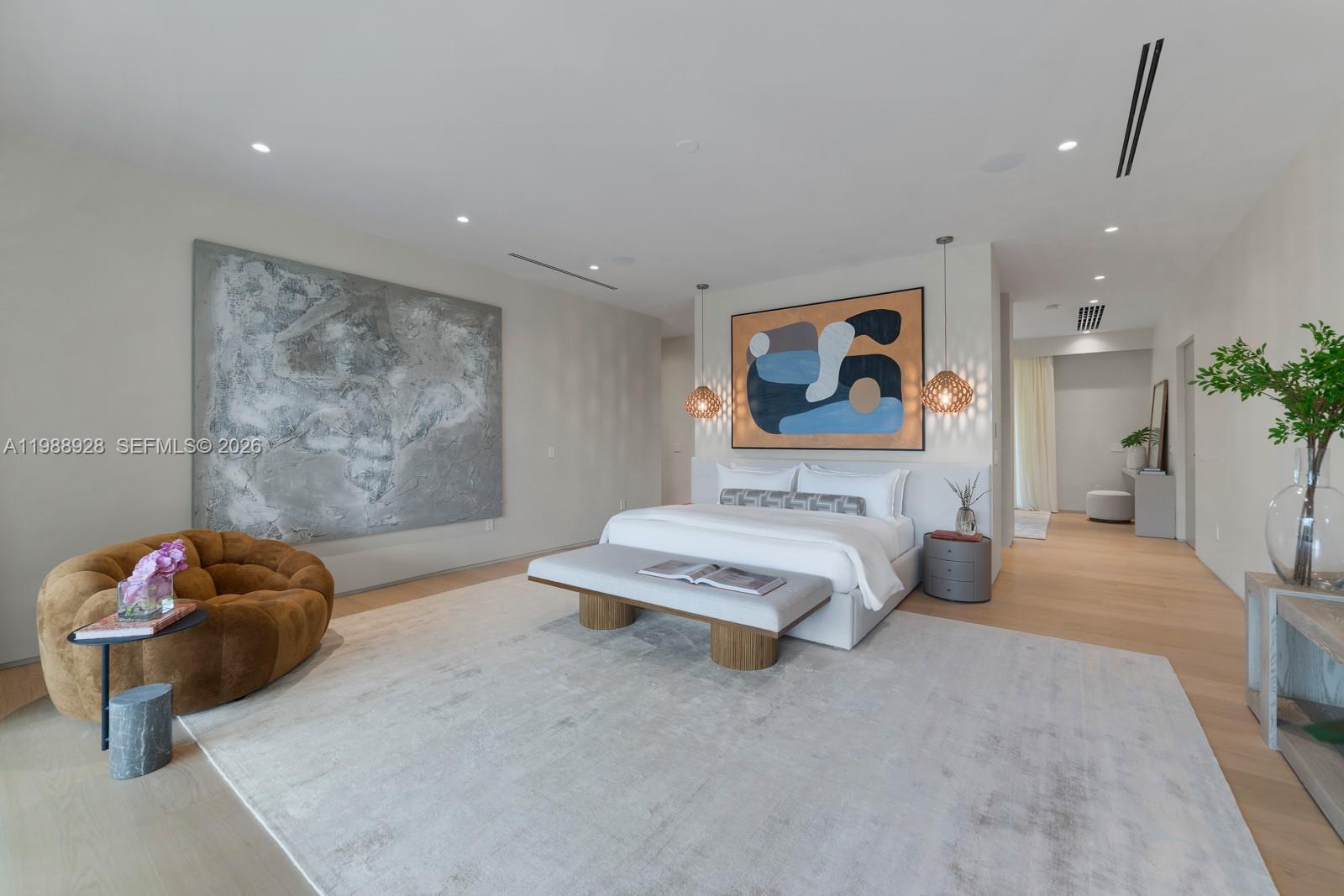 5545 Southwest 81st Terrace Miami, FL 33143 - Photo 42 of 100 a spacious bedroom with a bed and a painting on the wall