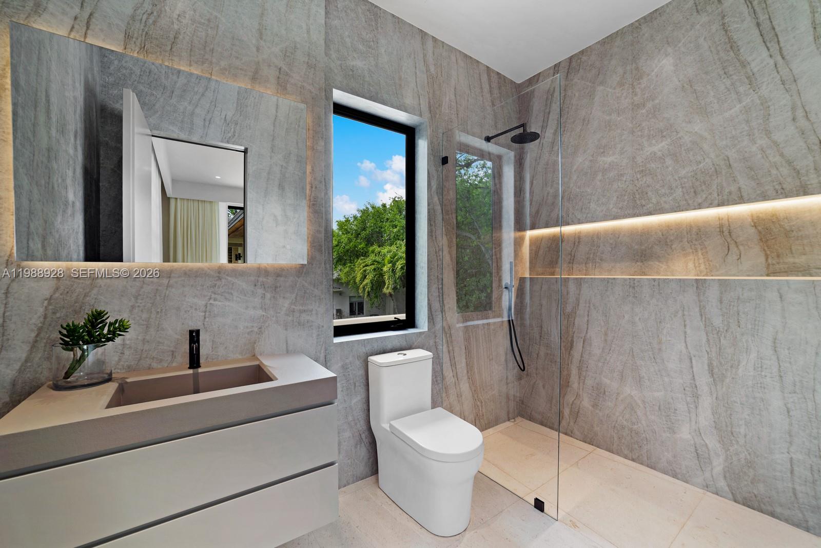 5545 Southwest 81st Terrace Miami, FL 33143 - Photo 47 of 100 a bathroom with a toilet a sink and shower
