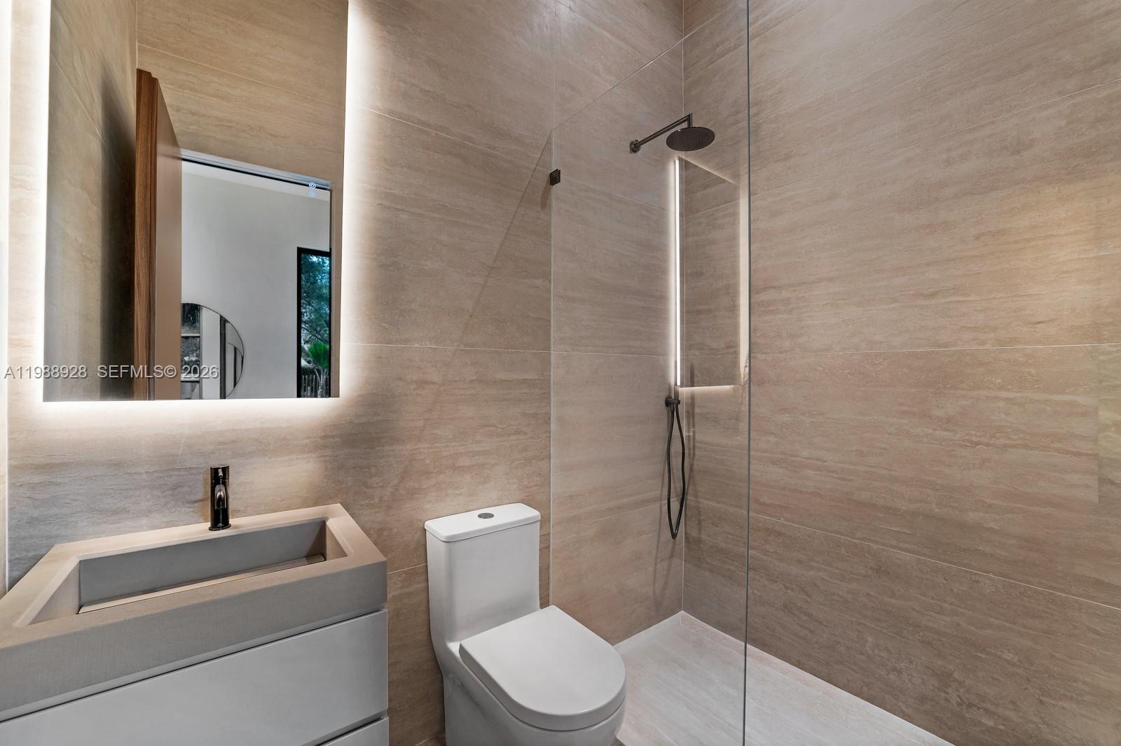 5545 Southwest 81st Terrace Miami, FL 33143 - Photo 48 of 100 a bathroom with a toilet sink and shower