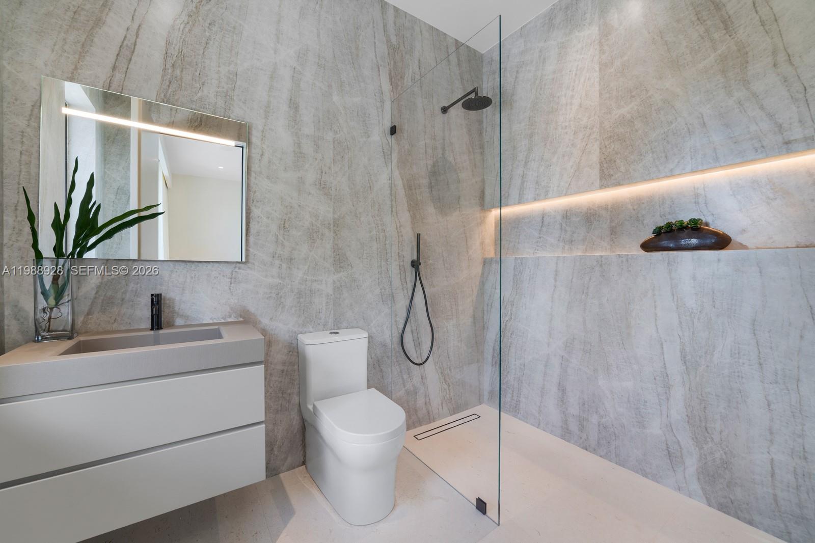 5545 Southwest 81st Terrace Miami, FL 33143 - Photo 51 of 100 a bathroom with a granite countertop sink a toilet and shower