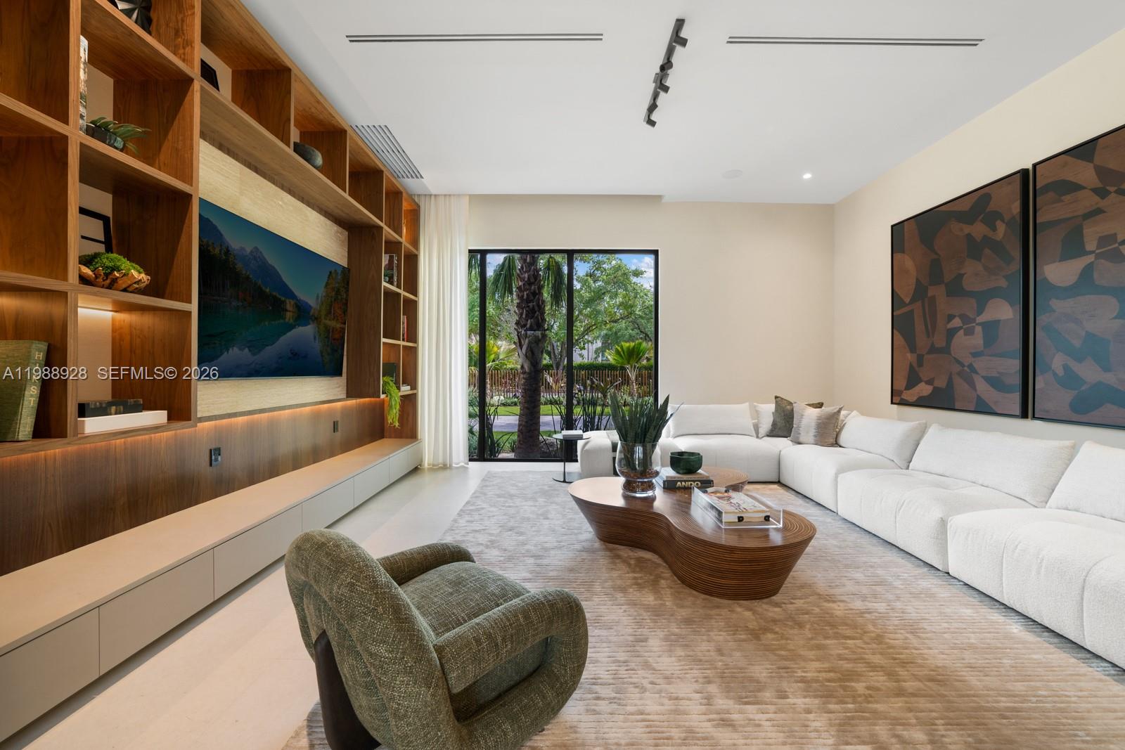 5545 Southwest 81st Terrace Miami, FL 33143 - Photo 7 of 100 a living room with furniture and a large window